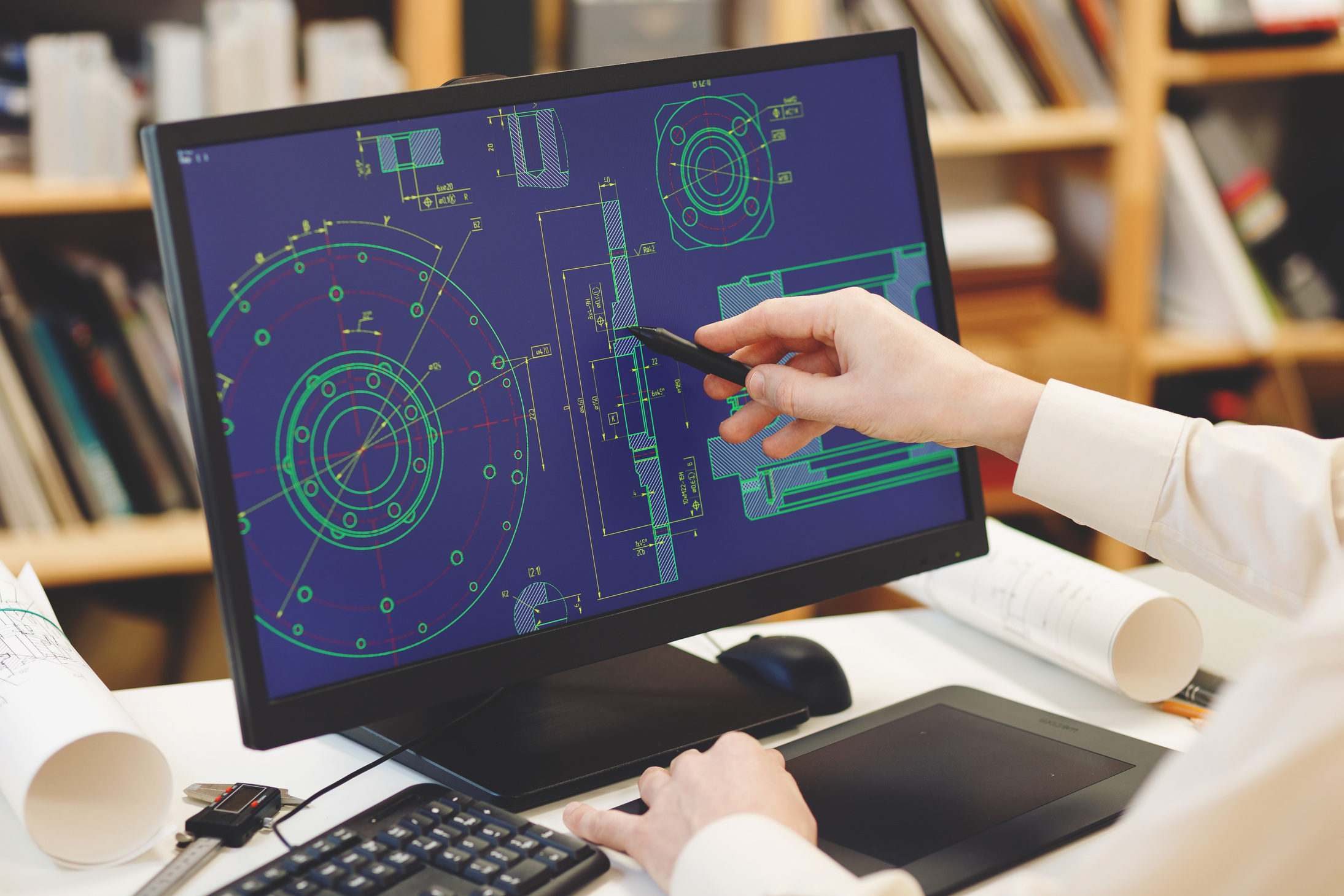 Engineer working on cad scheme. Engineer using computer tools.